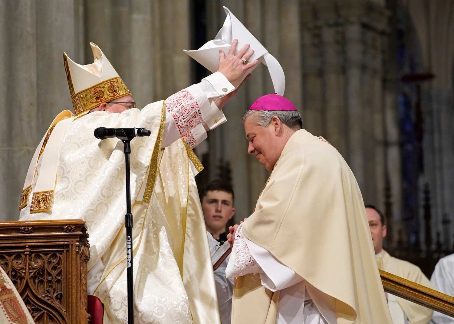 Cardinal Dolan places a miter on the head of Auxiliary Bishop John S. Bonnici, 57, during his episcopal ordination March 1 at St. Patrick's Cathedral.